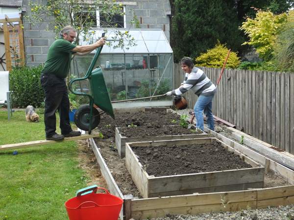 Using the soil to fill a raised bed